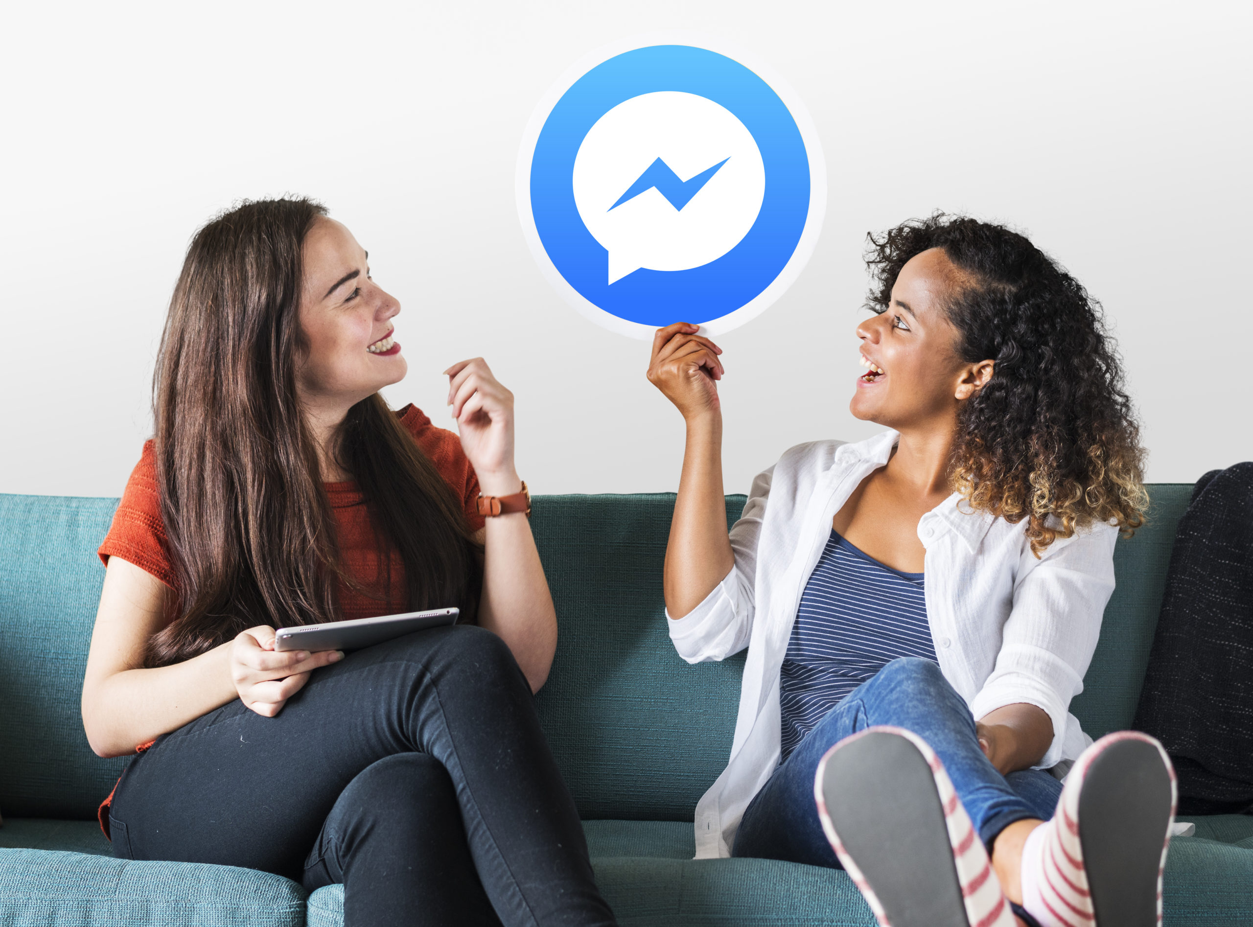 Young women showing a Facebook Messenger icon